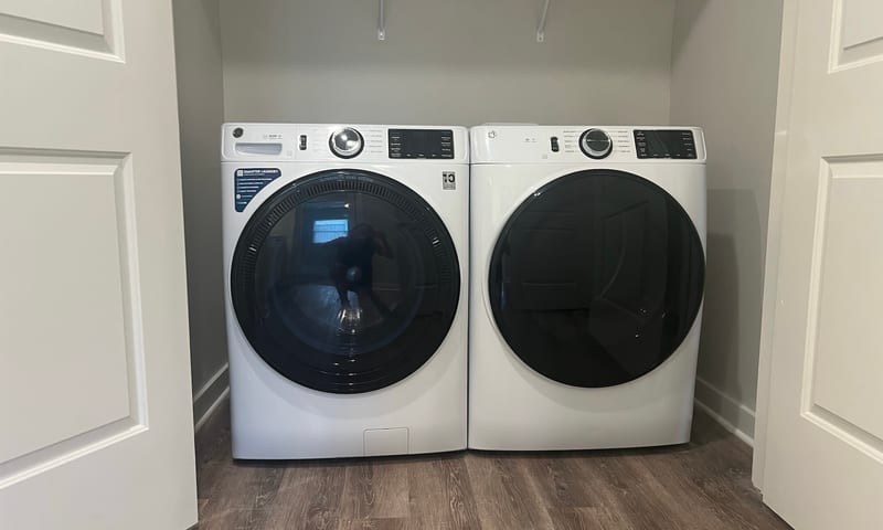 Front-loading washer and dryer in an apartment laundry closet