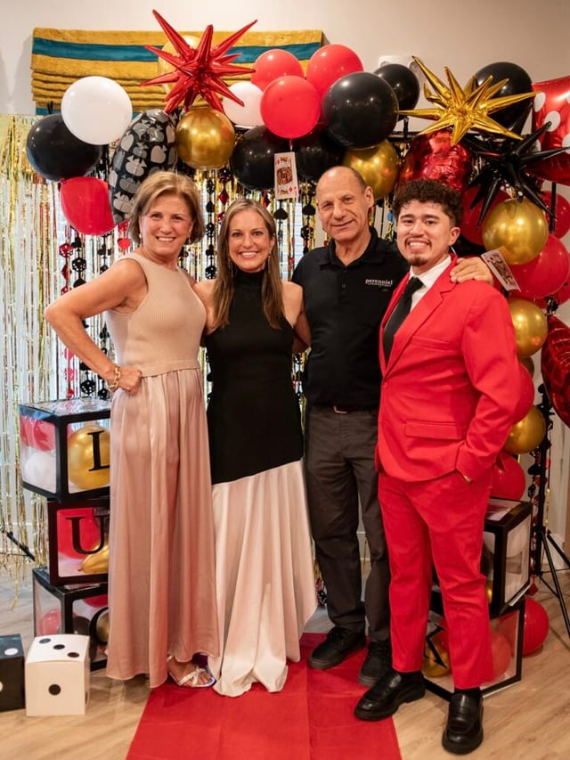 Four people posing at a Park Place community event