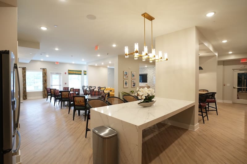 Clubroom kitchen island and dining tables